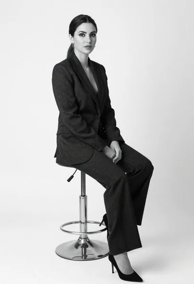 Black and white portrait of woman in tailored suit