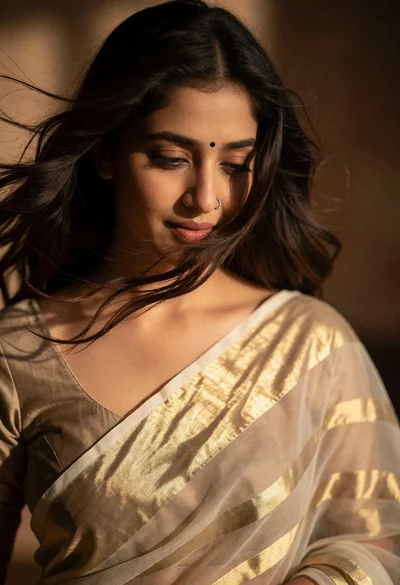 Close up portrait of woman with dark hair in sheer saree against