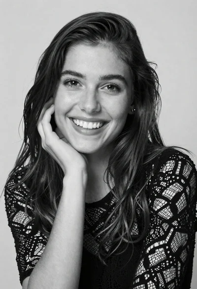 Black and white portrait of smiling woman with dark hair