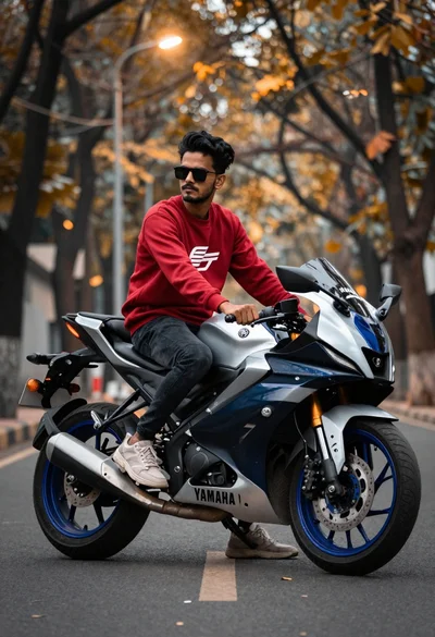 Man sitting on silver yamaha r15 motorcycle on autumnal street