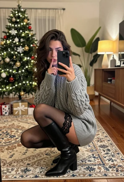 Young woman taking mirror selfie in cozy decorated living room setting