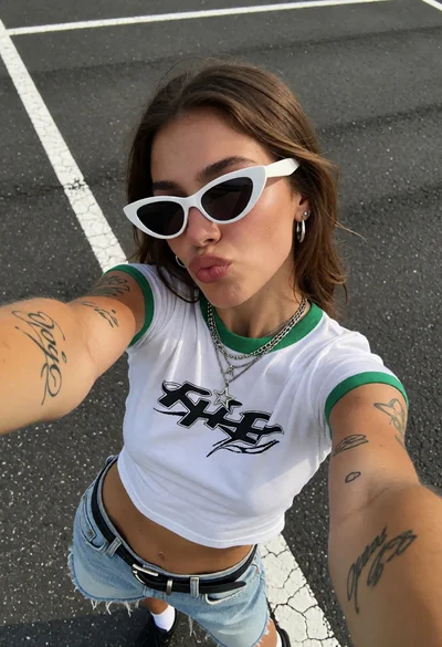 Young woman taking a selfie on an asphalt road with white painted