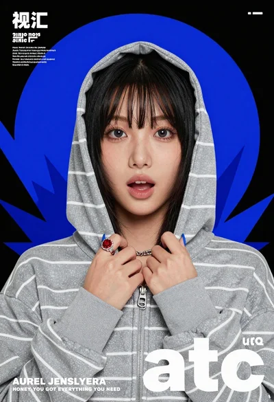 Young east asian woman in grey striped hoodie holding zipper against black