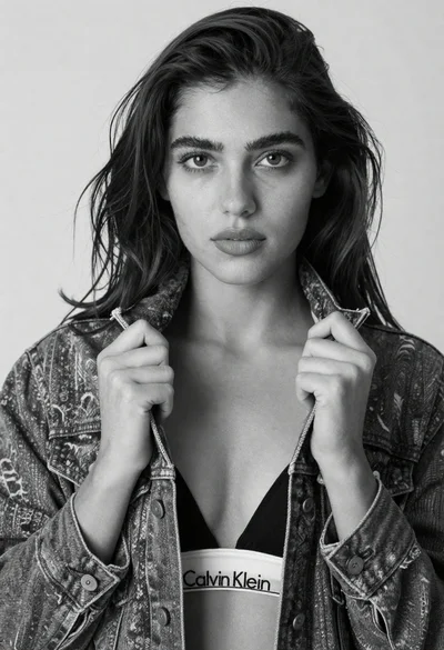 Black and white close up portrait of young woman with dark hair
