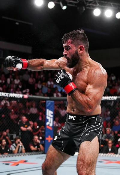 Muscular fighter recoiling from punch in bright arena