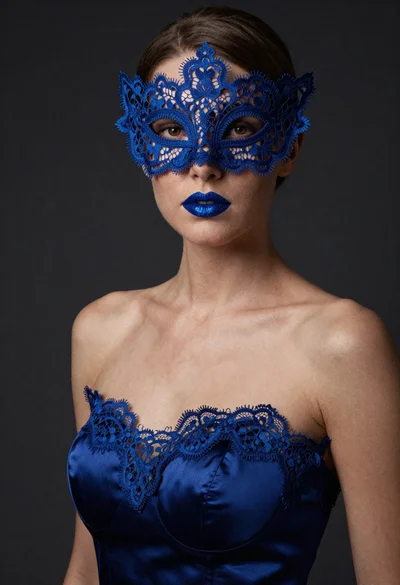 Portrait of woman in blue lace mask and satin gown