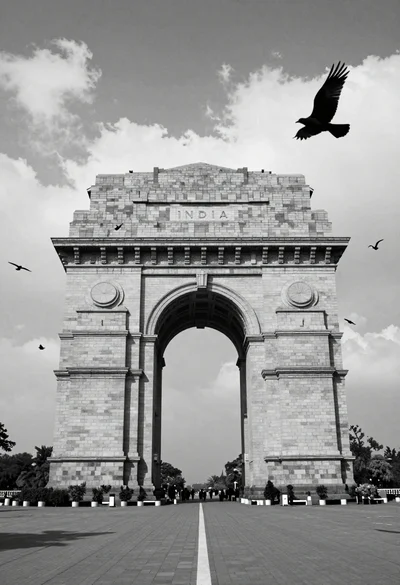 Monumental stone triumphal arch inscribed with india against dramatic cloudy sky