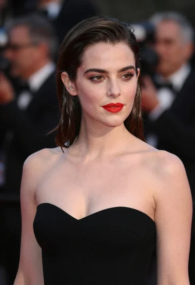 Close up portrait of woman in black gown at evening event
