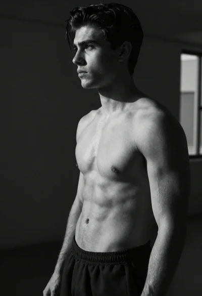 Black and white portrait of muscular man in studio