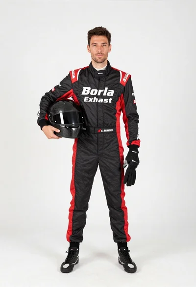 Male race car driver in black red racing suit holding helmet glove