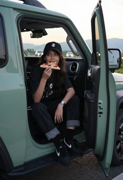Young woman eating pizza sitting in open suv door at sunset