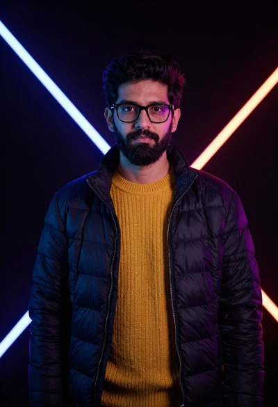 Man in puffer jacket with neon studio lighting portrait