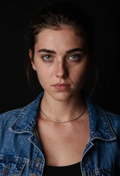 Studio portrait of young woman with green eyes