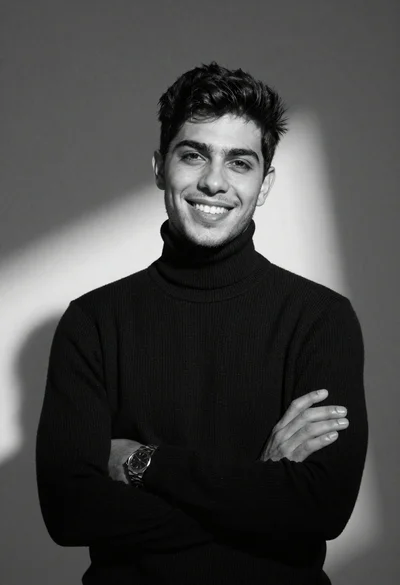 Black and white portrait of young man in turtleneck sweater