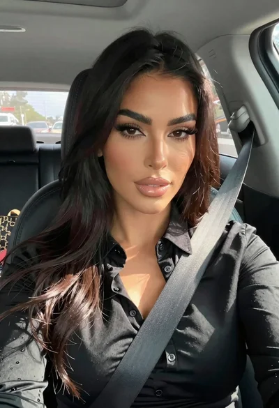 Close up portrait of woman in car seat with dark hair