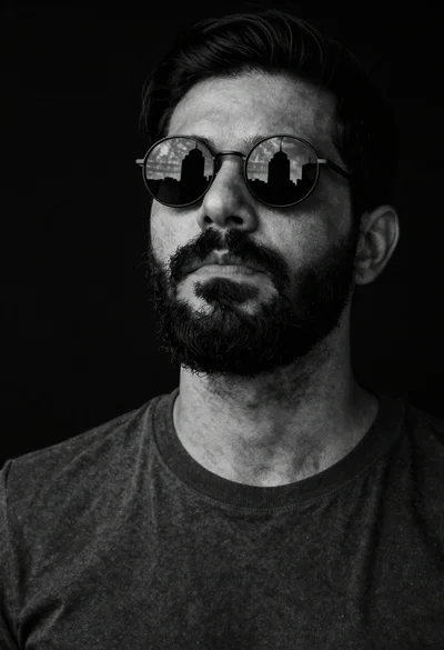 Black and white portrait of bearded man with sunglasses