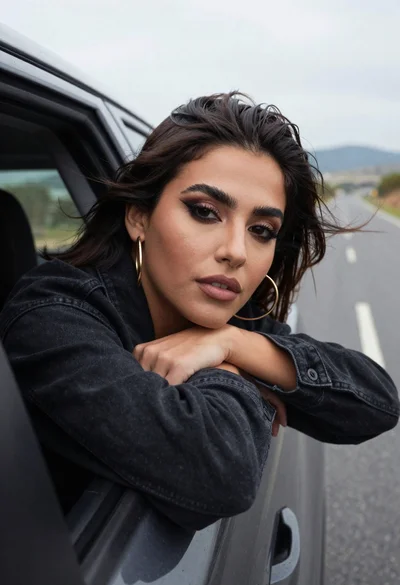 Woman leaning out car window roadside portrait