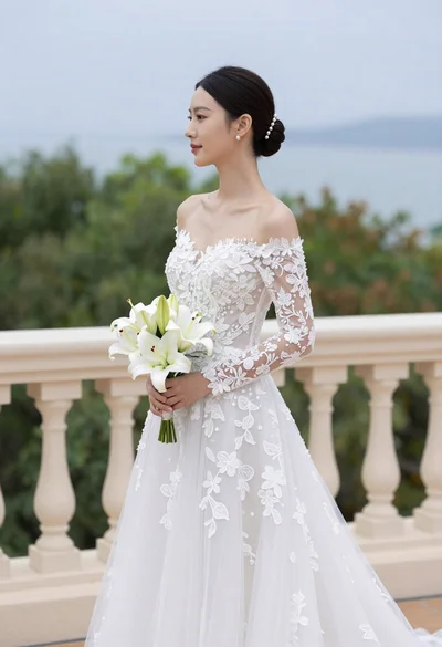 Bride in white gown holding lilies on outdoor balcony overlooking blue water