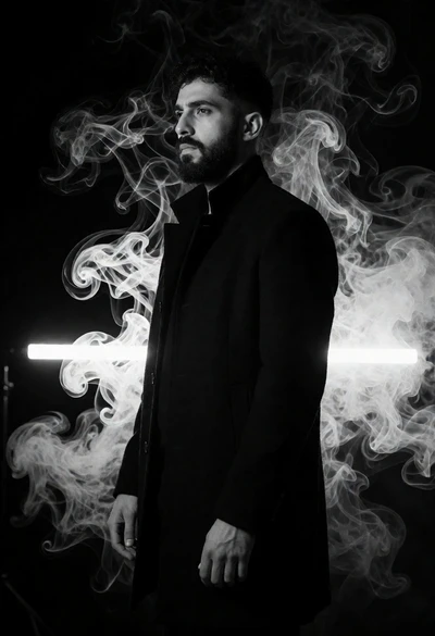 Man in black coat profile against swirling smoke and horizontal light bar