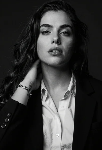 High contrast black and white studio portrait of woman with dark hair