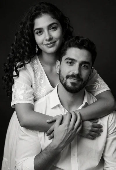 Black and white medium closeup portrait of an embracing couple