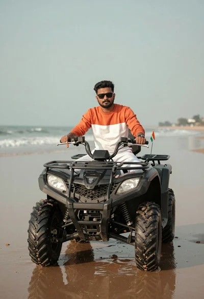 Man sitting confidently on an atv parked on wet sand near the
