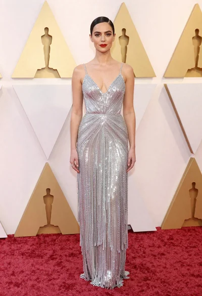 Full body portrait of woman in silver sequin gown at red carpet