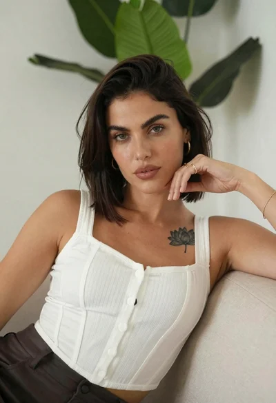 Medium close up portrait of woman on beige sofa in modern room