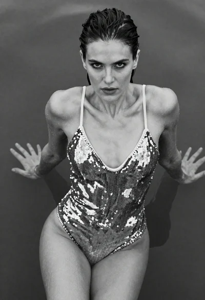 Black and white fashion portrait of woman emerging from water