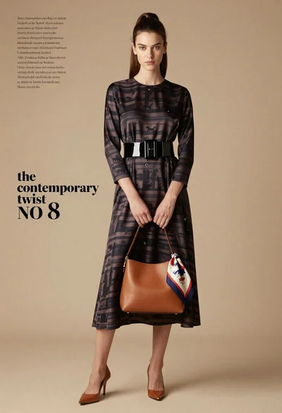 Full length fashion editorial of woman in striped silk dress studio