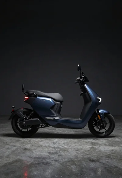 Dark blue electric motorcycle in a studio setting