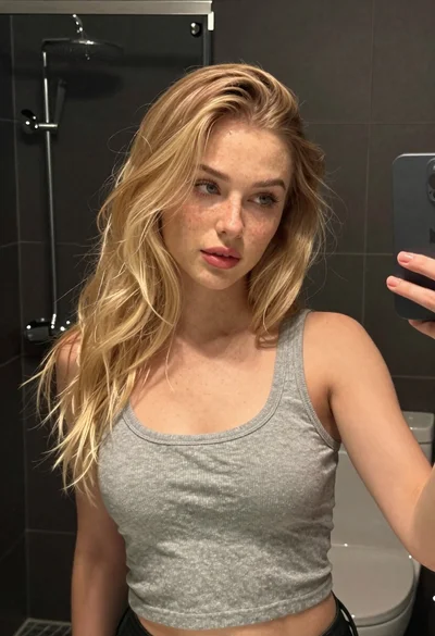 Young woman selfie in bathroom mirror