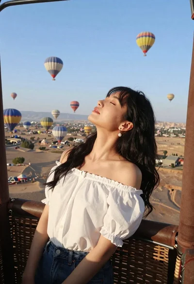 Young woman relaxing in hot air balloon basket over desert landscape