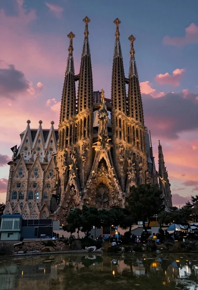 Illuminated sagrada familia cathedral facade reflecting on dark water at twilight