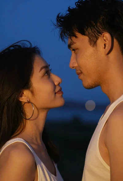 Close up portrait of couple gazing into eyes at deep blue twilight