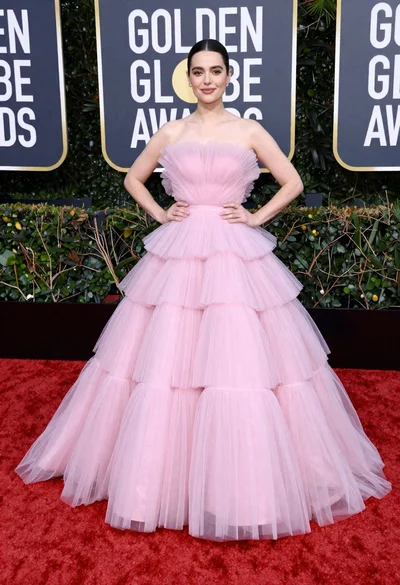 Full length portrait of woman in pink ballgown on red carpet