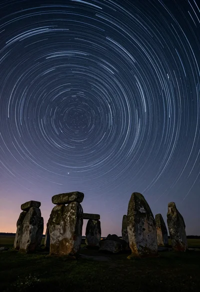 Majestic ancient stone circle dolmen silhouetted against swirling star trails at night